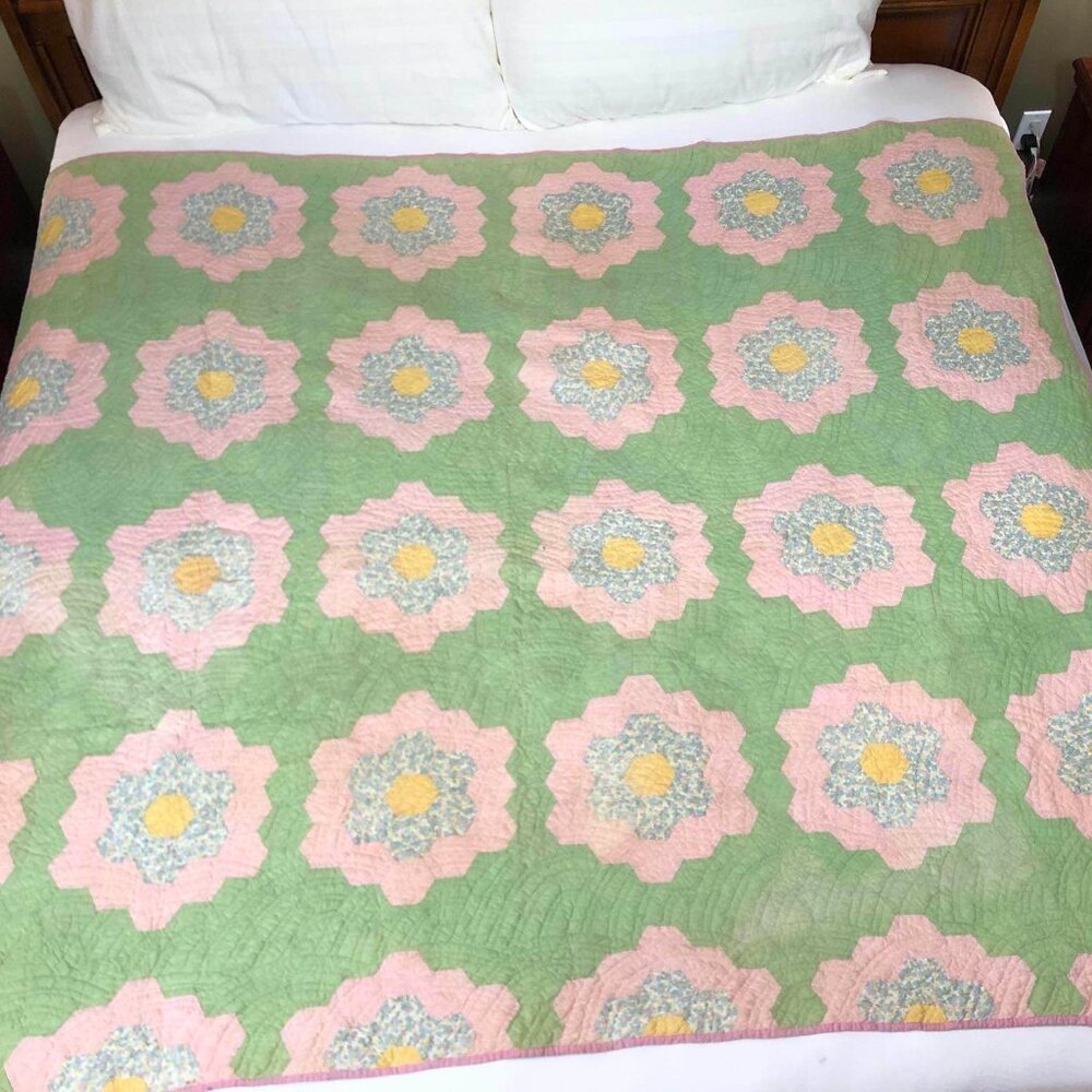 Antique hand sewn quilt - green with pink, yellow & blue floral design
